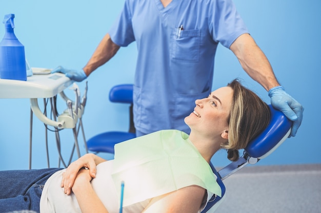 Dentist with dental equipment in dentistry office