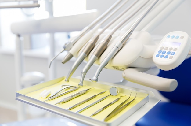 dentistry, medicine, medical equipment and stomatology concept - close up of dental instruments