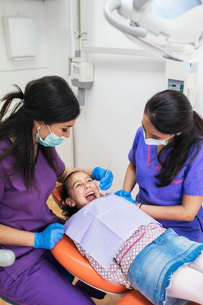 Dentists during a dental intervention with a patient. Dentist Concept