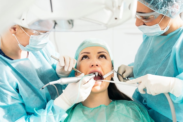 Dentists with a patient during a dental intervention. Dentist  Concept