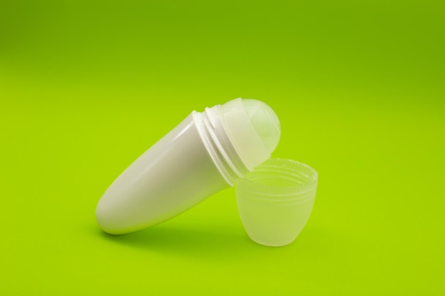 Deodorant on a bright green background