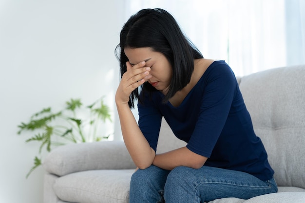 Depression and mental illness Asian woman disappointed sad after receiving bad news Stressed girl confused with unhappy problems arguing with boyfriend cry and worry about unexpected pregnancy