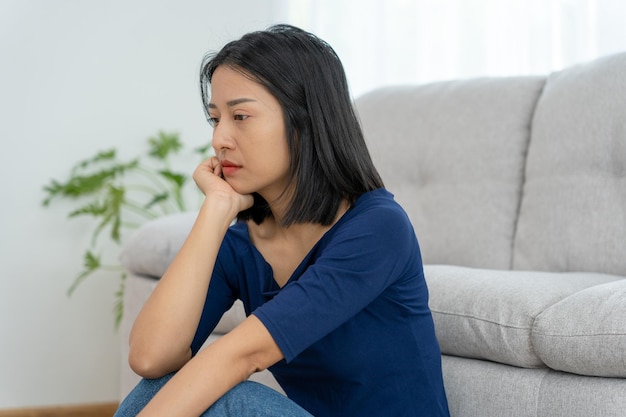 Depression and mental illness Asian woman disappointed sad after receiving bad news Stressed girl confused with unhappy problems arguing with boyfriend cry and worry about unexpected pregnancy