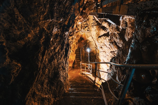 Descent into limestone caves for speleological sightseeing