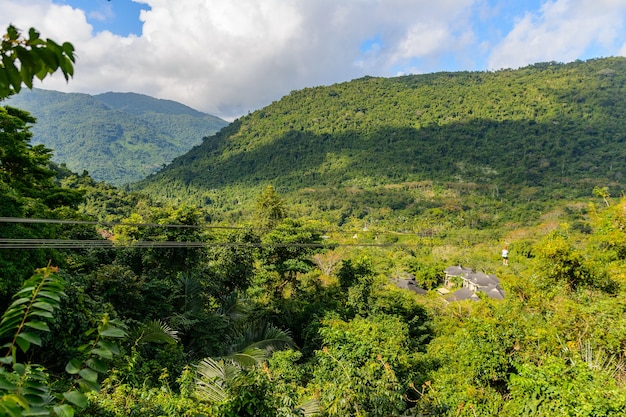 Descent to Zipline through mountains, tropical forest in Yanoda Park,  Sanya city. Rainforest cultural tourism zone Yanoda, Hainan island, Yalong Bay Tropical Paradise Forest Park. China.