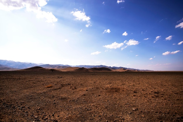 Desert landscape steppe mountains blue sky