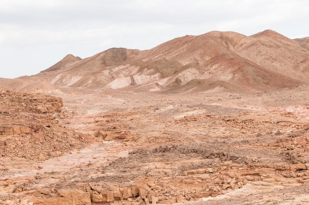 Desert red mountains rocks and cloudy sky Egypt color canyon