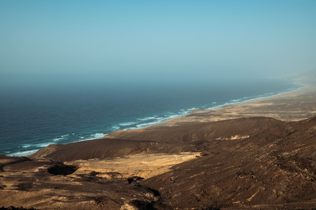 Deserted coast washed by ocean