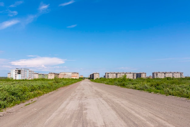 Deserted road to the empty abandoned city