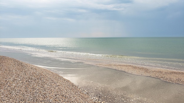 Deserted shore without people clear sunny day calm turquoise sea seacoast