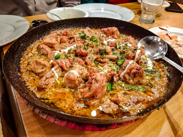 Desi butter chiken masala serverd in karahi top view of indian pakistani karai food