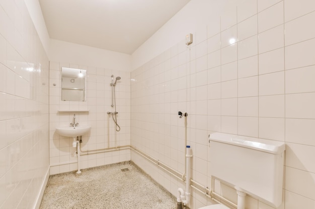 The design of a charming bathroom with a white tiled wall