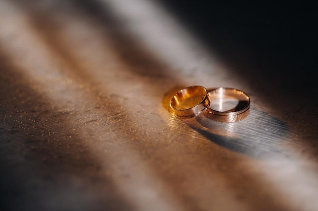 Designer wedding rings lying on the surface Two wedding rings