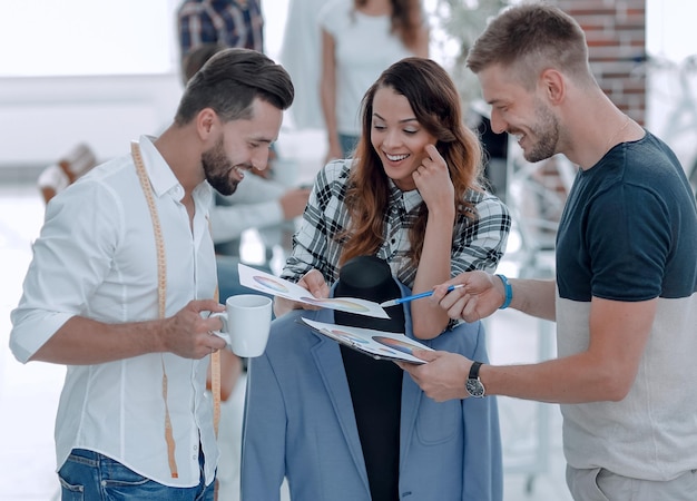 Designers discussing the design of the male suit