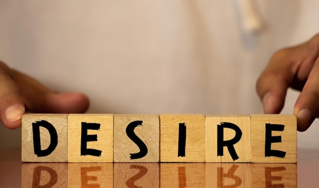 Photo desire word on wooden cubes