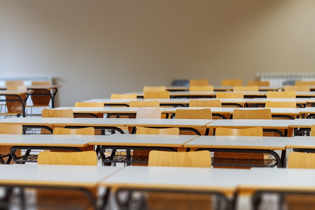 Desk and chairs in classroom