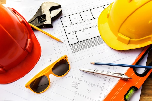 A desk of contractor engineers who are going to build a low cost home and save energy