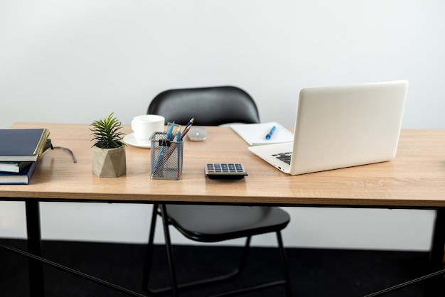 Desk for study work or freelance with note pad pen and laptop Online learn concept