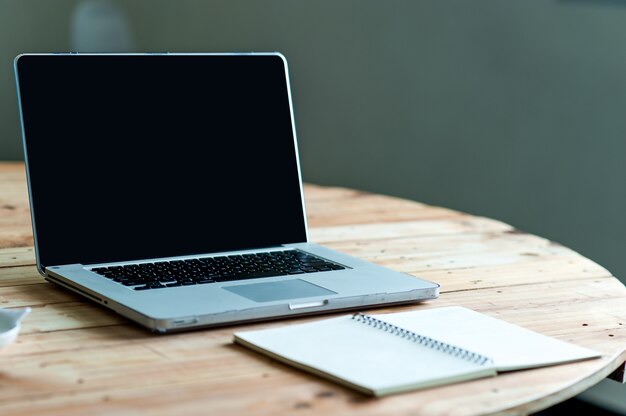 A desk with a business computer and a note on the desk. Business concept with copy space.