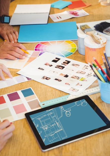 desk with design tools and tablet with office lines (two-tone: blue and light orange)