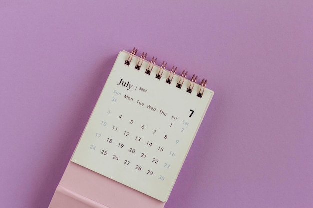 Desktop calendar for July 2022 on a lilac background