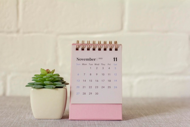 Desktop calendar for November 2022 on the table