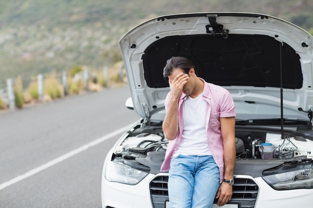 Desperate man after a car breakdown 