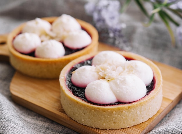 Dessert basket with blueberries jam on wooden tray