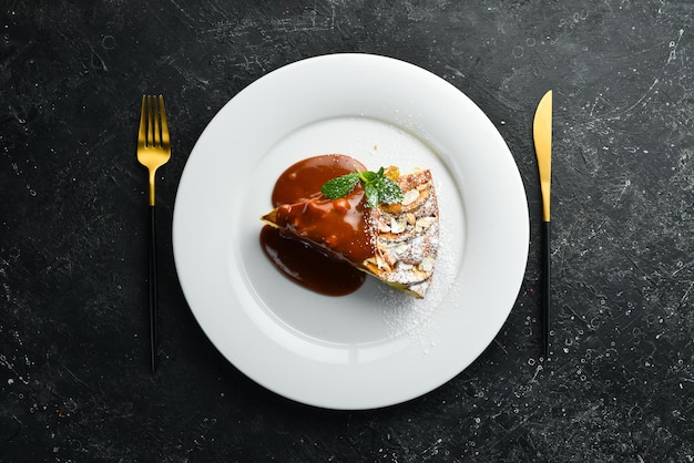 Dessert Biscuit apple pie with caramel topping on a plate Top view