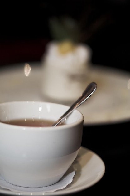 Dessert cake and a cup of tea close up