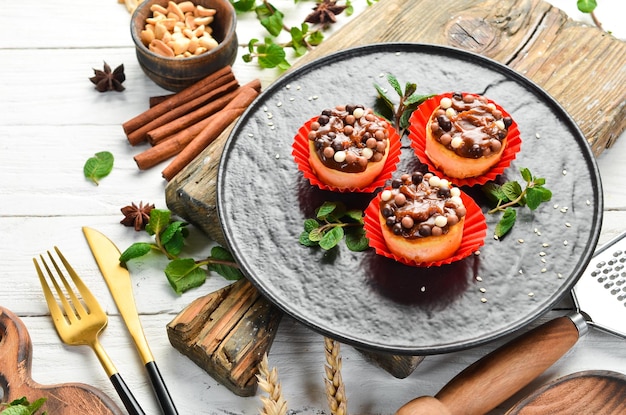 Dessert Caramel cakes and chocolate pills Sweets Top view Rustic style