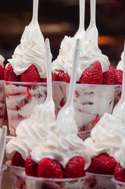 Dessert of strawberries with cream closeup