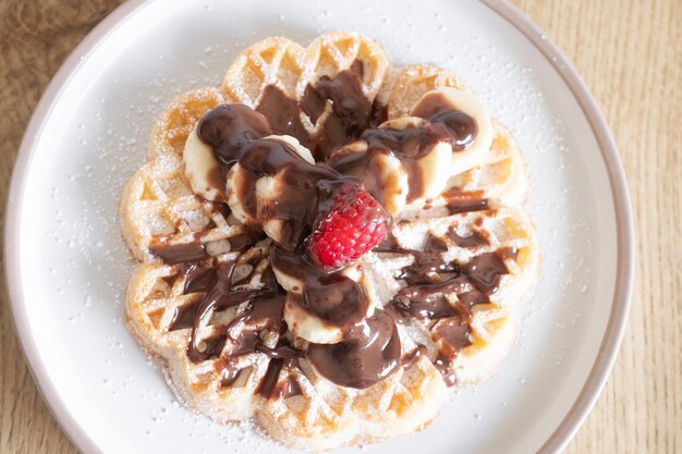 Dessert waffles with raspberries and bananas