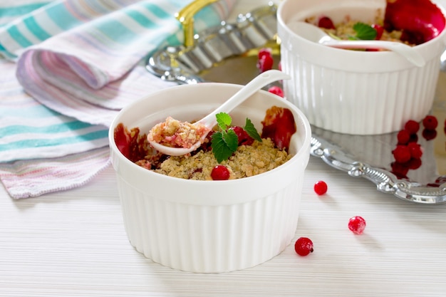 Dessert with red currants in a rustic style