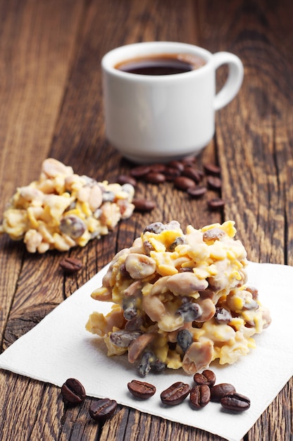 Dessert with white chocolate and coffee on wooden table