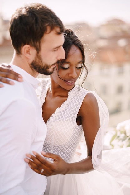 Destination fineart wedding in florence italy interracial wedding couple caucasian groom and