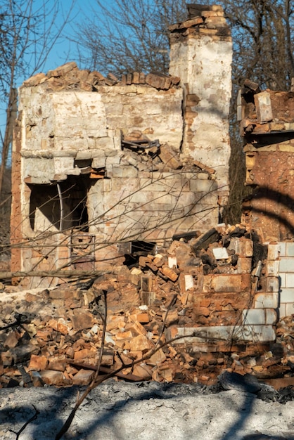 Destroyed houses as a result of a fire in Russia Bricks and parts of walls various household items broken windows covered with ash lie on the surface of the earth Natural disaster