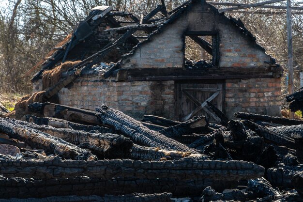 Photo destroyed houses in ukraine after a shell hit the war in ukraine with russia the concept of the consequences of a missile bomb attack on a peaceful residential building