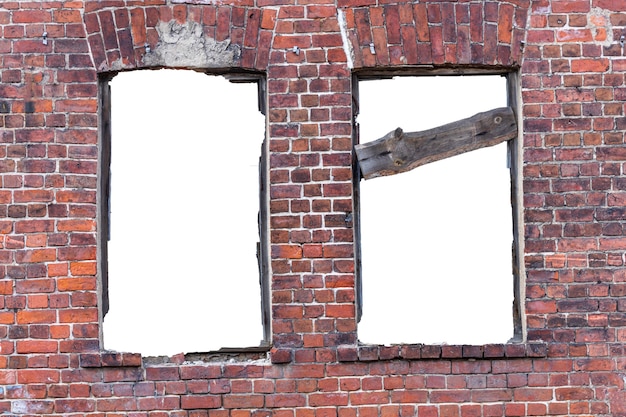 Destroyed wall of old bricks with a hole in the middle. isolated on white background. grunge frame. vertical frame. High quality photo