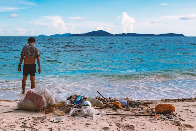 The destruction of nature by the hand of man. From household garbage being dumped into the sea.