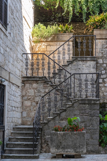 Detail of the ancient cast iron railing on a stone staircase in the old town of Kotor Montenegro