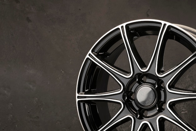 Detail of beautiful black with polished front surface alloy wheel car parts