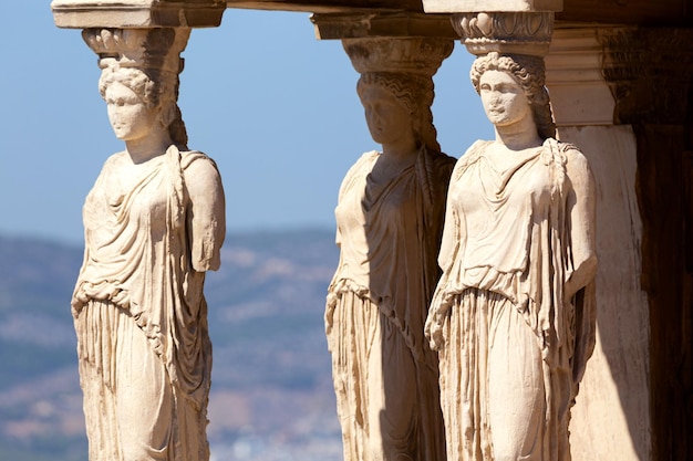 Detail of Caryatid Porch on the Acropolis Athens Greece Ancient Erechtheion or Erechtheum temple World famous landmark at the Acropolis Hill