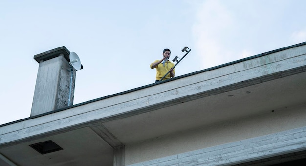 Detail of Construction worker on the roof of the house