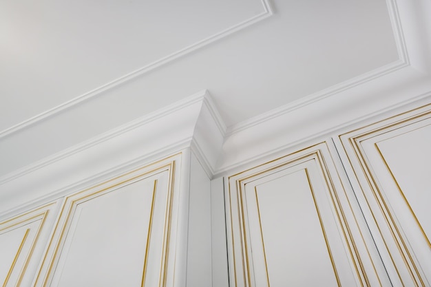 Photo detail of corner ceiling cornice with intricate crown molding