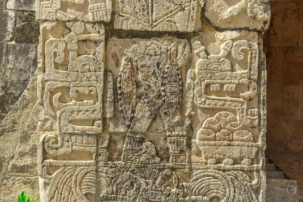 Photo detail of the maya inscriptions of the temple of the jaguar in the archaeological complex of chichen itza in mexico