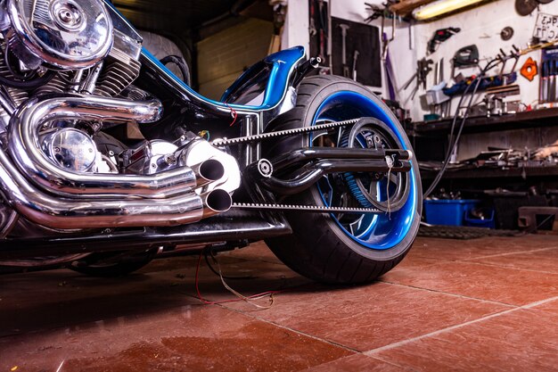 Detail on a modern motorcycle in the workshope. Motorcycle Exhaust.