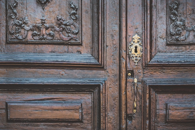 Detail of an old carved wooden door in neoclassical style