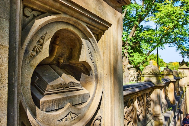 Detail of open book limestone sculpture in Central Park New York City