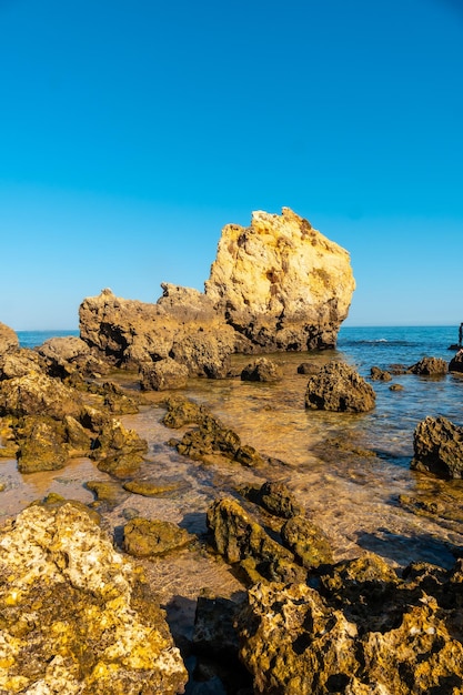 Detail of the rocks at Praia dos Arrifes Algarve beach Albufeira Portugal tourism in summer